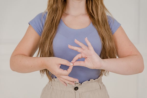 Female American Sign Language interpreter signing interpret.